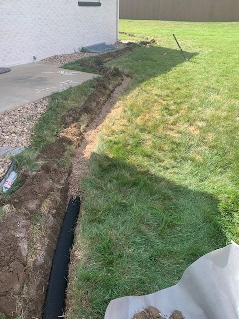 French drain trench with pea gravel in Thornton